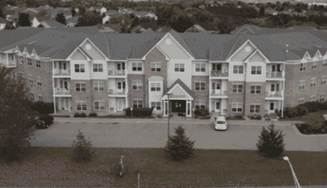 Modern senior apartment building in Sheldon, Iowa, featuring spacious units, community spaces, and beautiful landscape views designed for comfort and convenience.