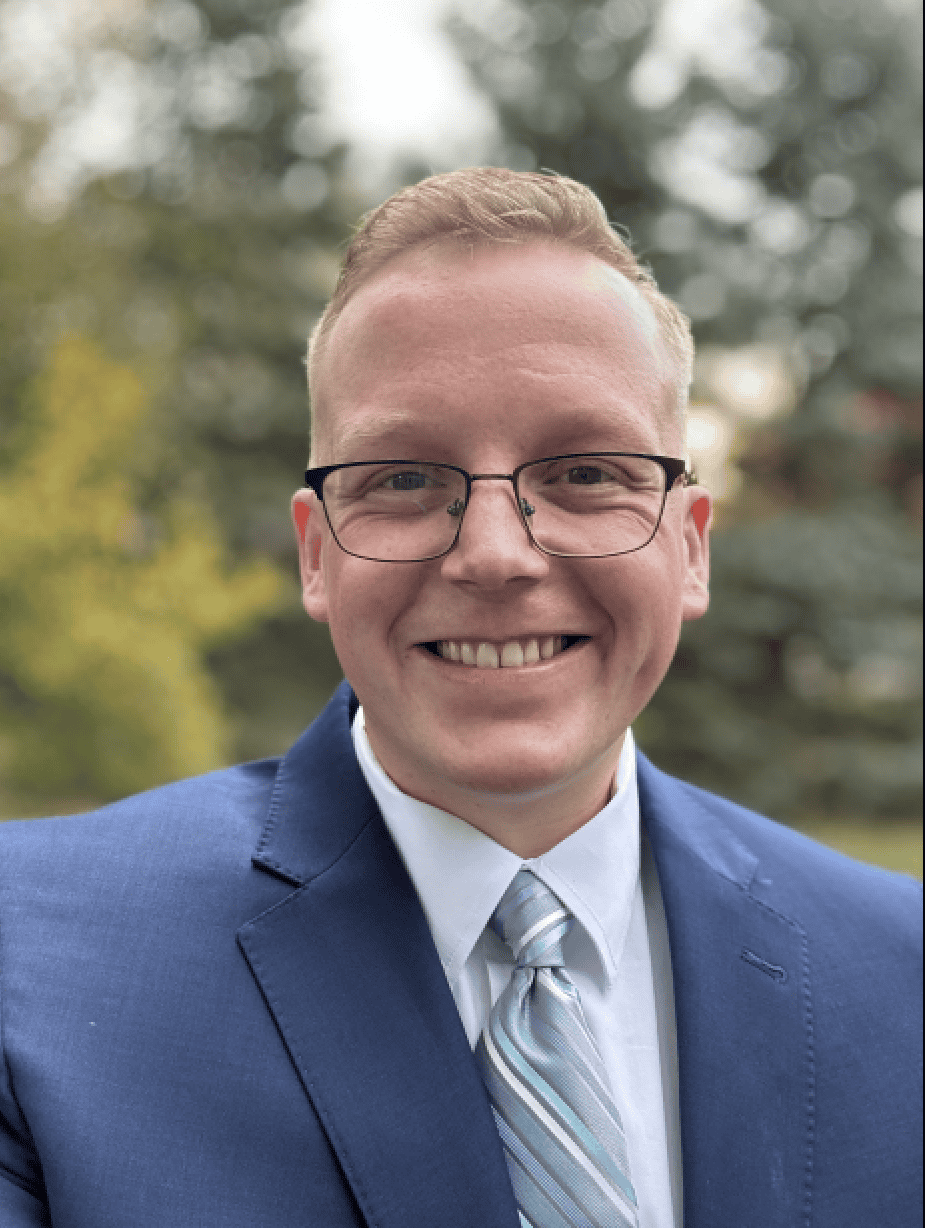 Friendly senior living resident at Vista Prairie at Windmill Ponds in Alexandria, MN, smiling outdoors, capturing a warm, welcoming atmosphere for senior living communities.