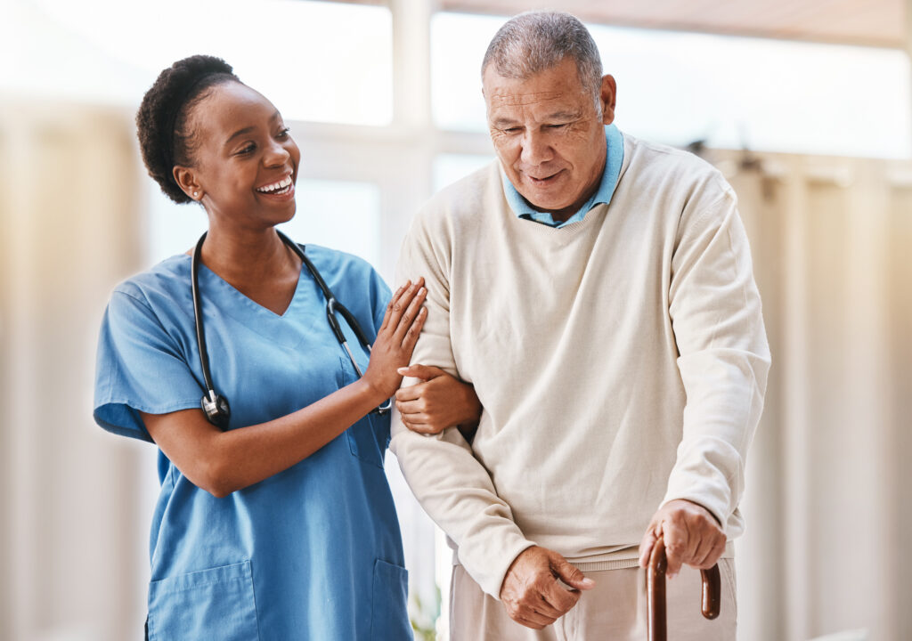 Senior living nurse assisting elderly man with walker at Vista Prairie at Ridgeway in New Ulm, MN, nursing care and senior healthcare services.