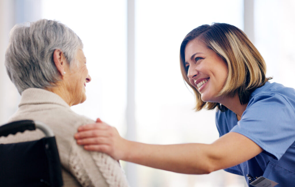 Elderly woman with caregiver at Vista Prairie senior living community in North Mankato, emphasizing compassionate senior care and assisted living services.