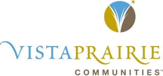 Bright exterior view of Vista Prairie at Eagle Pointe senior living community in St. Francis, Minnesota, showcasing accessible facilities and beautiful landscaped grounds.