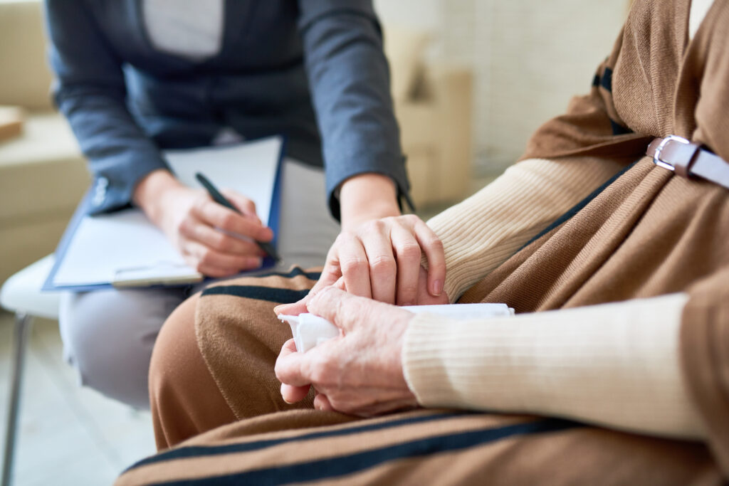 Comfortable elderly person receiving compassionate care at Vista Prairie senior living community in Willmar, MN.